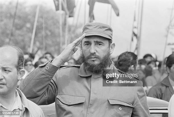 Cuban Premier Fidel Castro salutes as the Cuban national anthem is played. Castro canceled scheduled protocol activity and a rally in his honor to go...