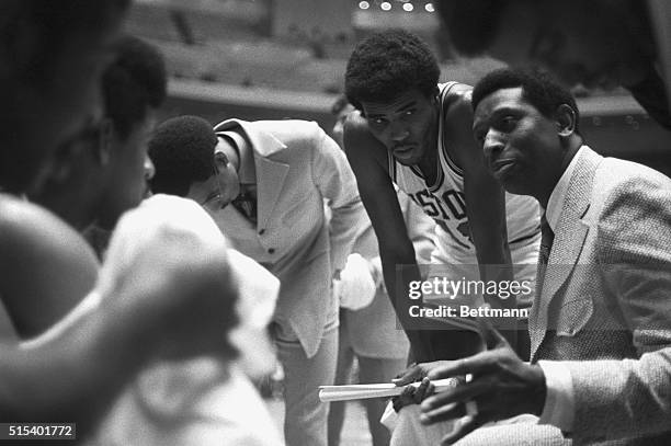Earl Lloyd, the new Detroit Pistons coach, discusses game strategy during a second period time-out huddle as the Pistons play the Portland Trail...