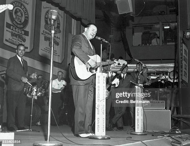 Photo of the Country-Western singer Tex Ritter, as he perfoms at the Grand Old Opry house for a TV special.
