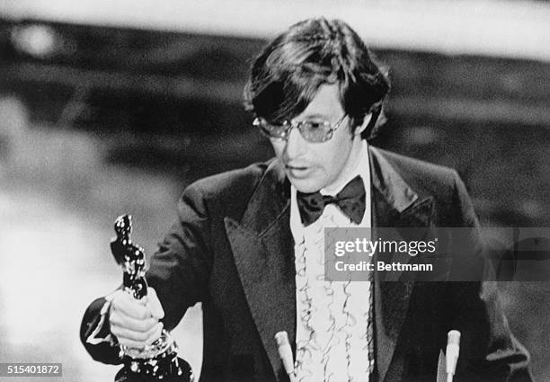 William Friedkin holds up his Oscar.