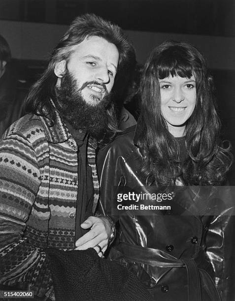 Who's that behind all that foliage? It's Ringo Starr of the Beatles, remember? With his wife, Maureen, he gets some attention from a photographer at...