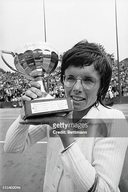 Defending champion Evonne Goolagong of Australia gave Billie Jean King of the U.S.A. A congratulatory kiss here after Mrs. King captured the only...