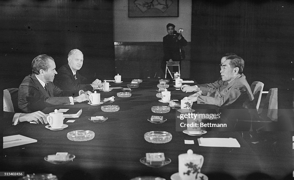 Richard Nixon and Others Sitting at Conference Table