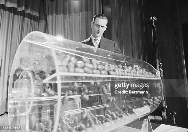 Washington: Selective Service Director Curtis Tarr spins the drum containing the sequence capsules, as the draft lottery got underway in the Commerce...