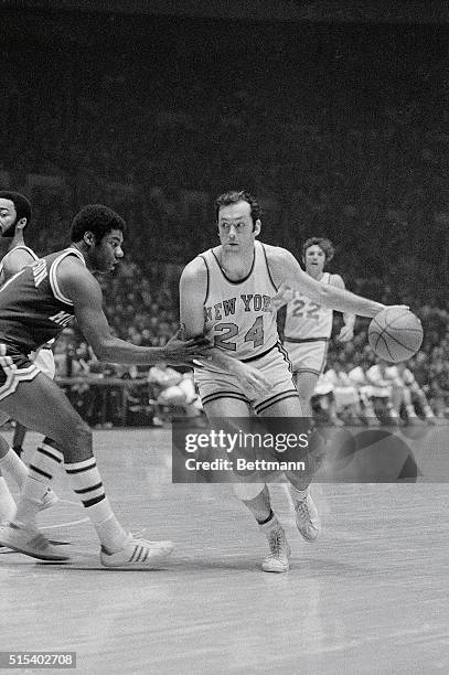 Bill Bradley, of the Knicks, is shown in action dribbling and looking to pass during game against Milwaukee Bucks.