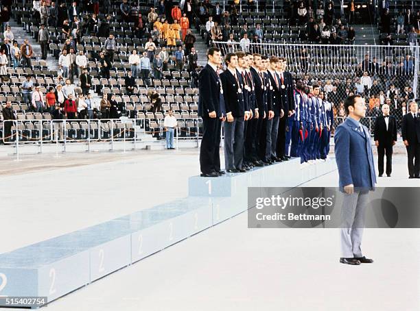 The Russian basketball team receive the gold medal flanked by the third placed Cuban team and a vacant rostrum where the silver medalist USA team...