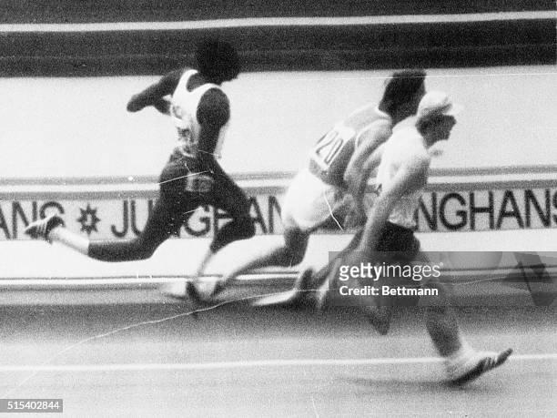 S Dave Wottle , of Canton, Ohio races across the finish line inches ahead of Soviet Union's Evgeni Arzhanov in the official finish photo of the...