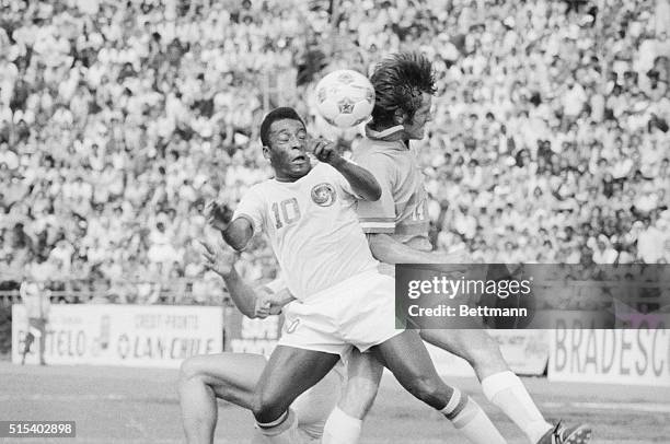 Cosmos' Pele slams into Bobby Moffat of the Dallas Tornados during the first half of their game at Downing Stadium here 6/15. Game ended in a 2-2 tie.