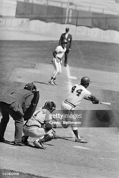 Milwaukee Brewers DH Hank Aaron singles in the third inning of the Brewers-Detroit tigers game in this photo, scoring from third base, and breaking...