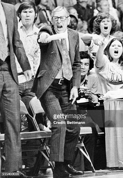 Coach John Wooden, who is referred in basketball circles as the "Wonder of Westwood", shouts directions to his players from the bench during NCAA...