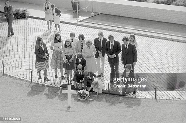 Members of the Kennedy family placed flowers and prayed at the grave of Robert F. Kennedy on the seventh anniversary of the assassination of the...