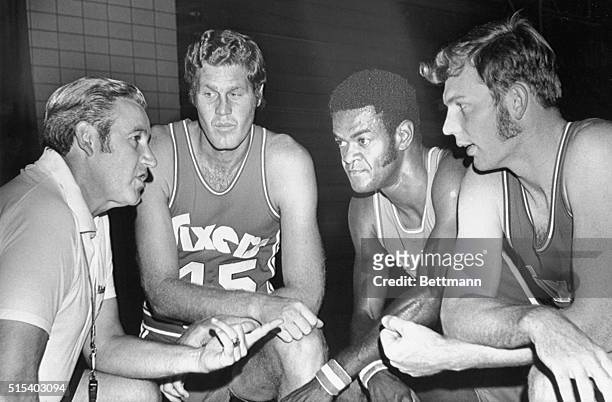 Philadelphia 76ers' basketball coach Roy Rubin huddles with three of his players at team's pre-season training camp at University of Scranton's John...