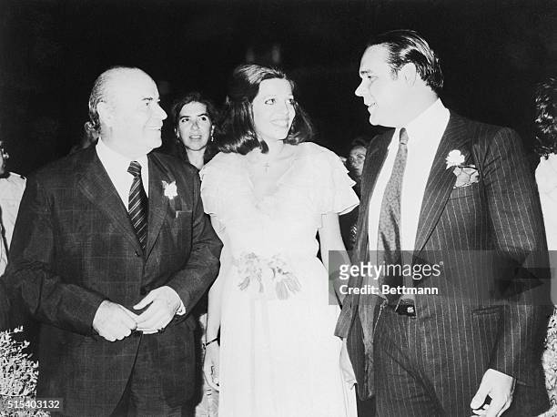 Big smiles mark the occasion as bride Christina Onassis Andreadis and her groom, Alexander Andreadis , chat with the groom's father, Professor...