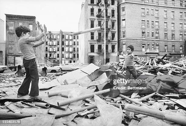 It's not a war zone or the scene of a headline-making disaster, but a kind of local "playground" on New York's Lower East Side. Youngsters play with...