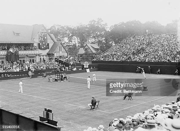 Forest Hills, New York: Left to right: Brooks, and Wilding of Australia, and Bundy and McLaughlin of America, showing McLaughlin serving.