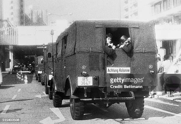 Munich, West Germany: Convoy of German riot police vehicles enters Olympic Village here, September 5, as inside village, Arab terrorists hold members...