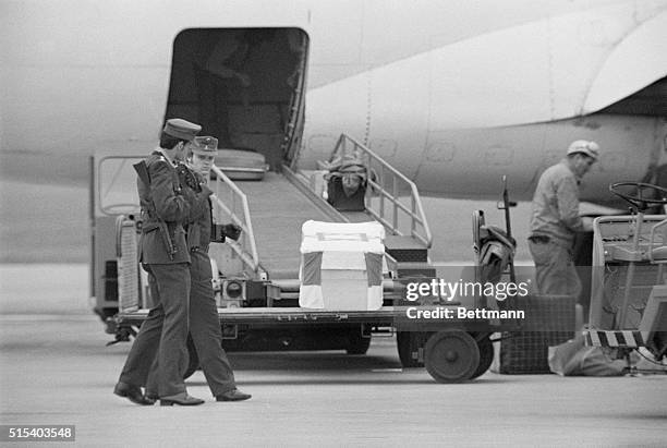 Armed guards stand by as caskets containing the bodies of Israeli Olympic athletes are loaded aboard a plane for flight to Tel Aviv. At the 1972...