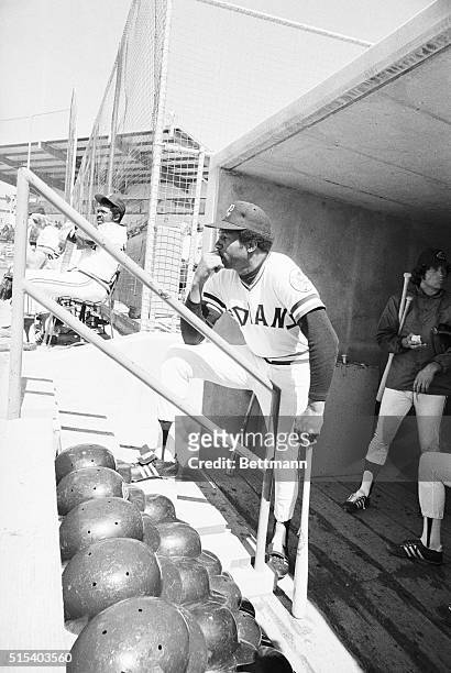 Arizona: With a bat in one hand, baseball's first major league black manager Frank Robinson of the Cleveland Indians seemingly looks forward to the...