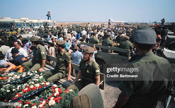 Tel Aviv, Israel: Bodies of Olympic Atheletes killed in terrorist attack Sept. 5th,1972 in Munich lie on commamd cars following thier arrival here...