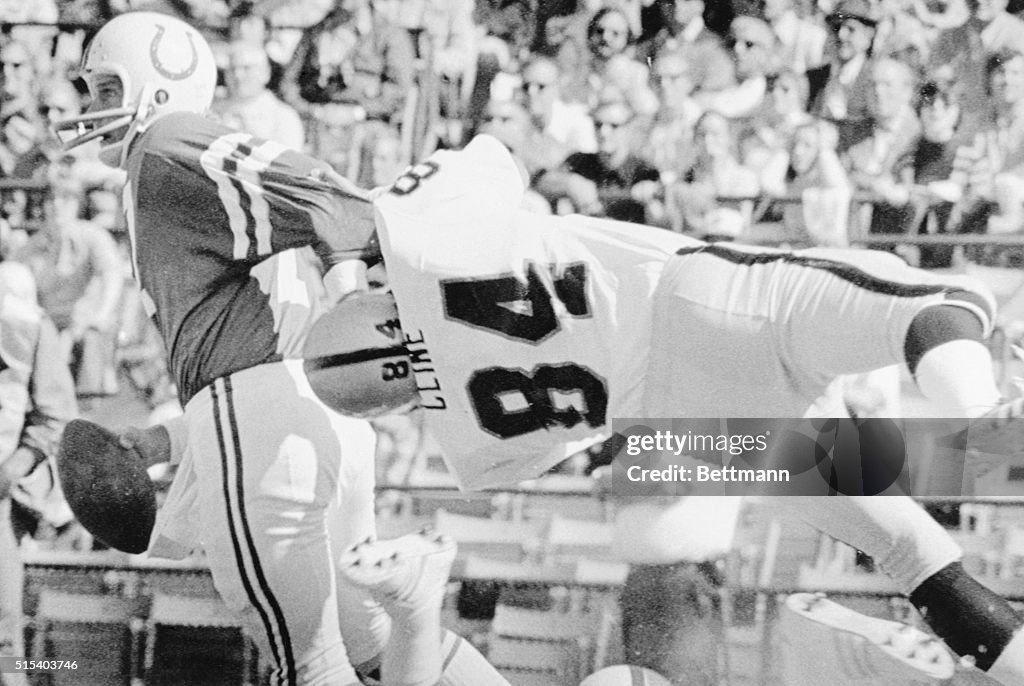 Quarterback Bert Jones Eluding Tackle