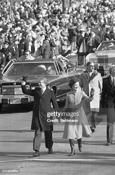 Washington, DC- The new President of the US, Jimmy Carter, holds hands with his First Lady, Rosalynn, as they walk down Pennsylvania Avenue in the...