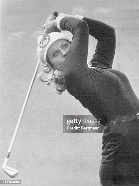 Australian Jan Stephenson bends way back as she watches her ball fly after hitting a shot from the fairway on the 14th hole during the first round of...