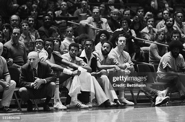 Red Holzman, coach of the New York Knicks, shown on the sidelines during game action against Philadelphia 76ers. Seated left to right: Red Holzman,...