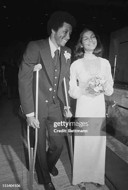 Tennis star Arthur Ashe with his bride, Jeanne Marie Moutoussamy, after their wedding 2/20 at the UN Chapel with U.S. Ambassador Andrew Young...