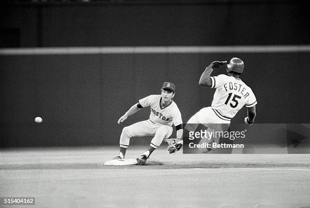 Cincinnati, Ohio: Stealing. The Reds' George Foster steals second base in second inning of third game in World Series here Oct. 14. The ball got past...