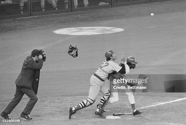 Cincinnati, Ohio: Umpire Larry Barnett takes off his mask to call controversial play in 10th inning of 3rd game of World Series. Red Sox catcher...