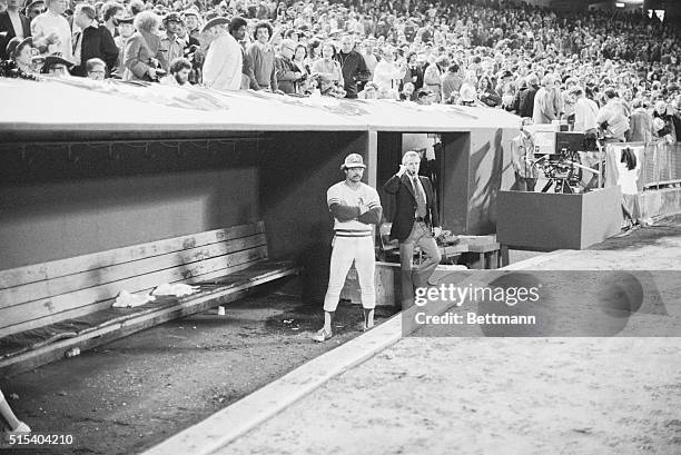 There isn't any joy either in the dugout, or from the fans behind it, as Reggie Jackson of the Oakland Athletics watches jubilant Boston Red Sox...