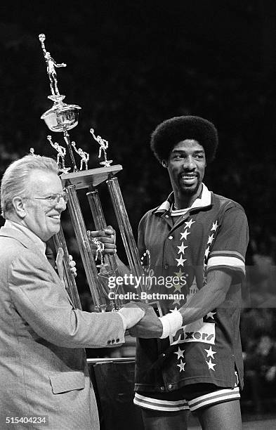 Commissioner Larry O'Brien presents the Most Valuable Player award to Julius Erving of the Philadelphia 76ers in the NBA all Star game in Milwaukee,...