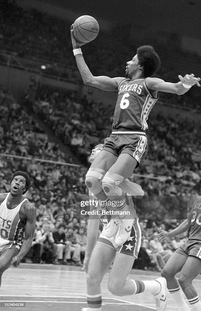 Julius Erving Leaping to Make Basket