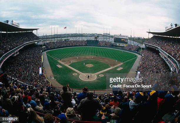 Wide shot of the Milwaukee County Stadium shows an excited crowd watching the World Series featuring the St. Louis Cardinals and the Milwaukee...