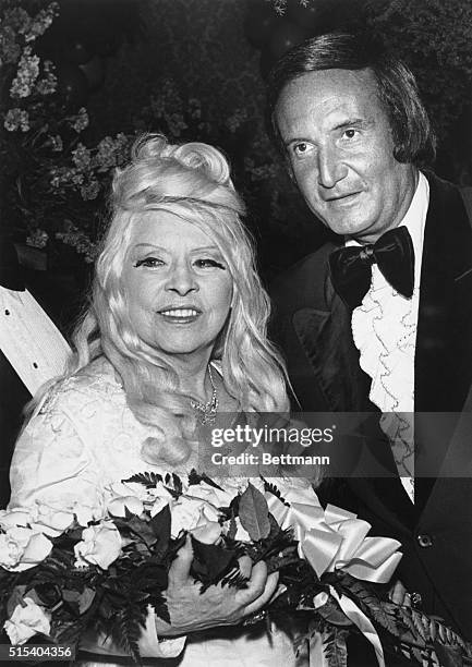 Hollywood, California: Making her first appearance at a live TV event in 12 years, actress Mae West is greeted by Don Kirshner as she arrives for the...