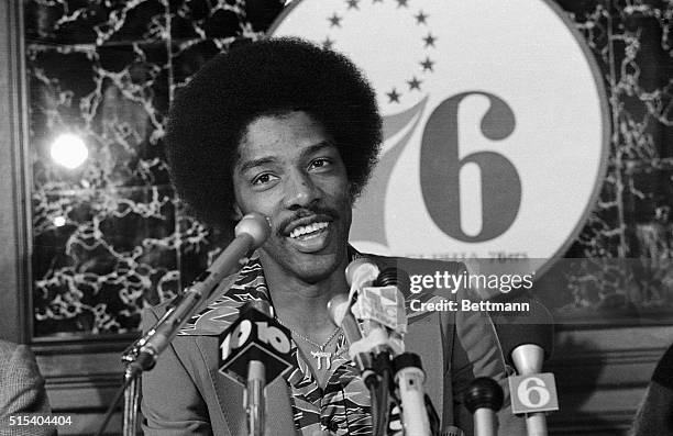 Smiling Julius Erving greets newsmen here 10/21 after he signed a 3.5 million dollar contract with the Philadelphia 76ers. Erving had been playing...