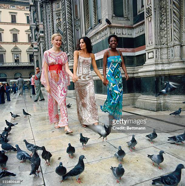 Florence, Italy: These three long evening dresses by Emilio Pucci are done in printed silk.