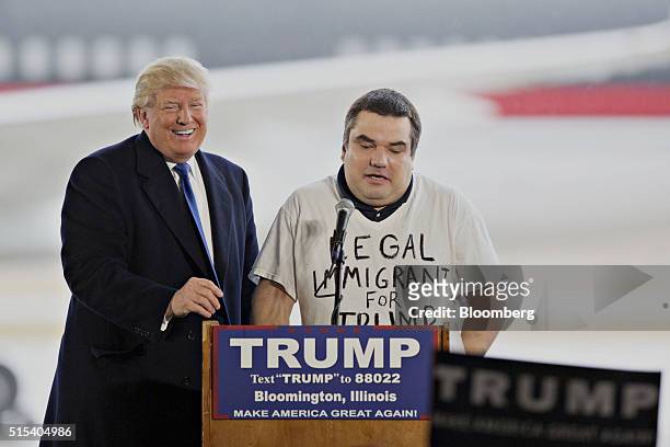 Donald Trump, president and chief executive of Trump Organization Inc. And 2016 Republican presidential candidate, left, stands with a man he called...