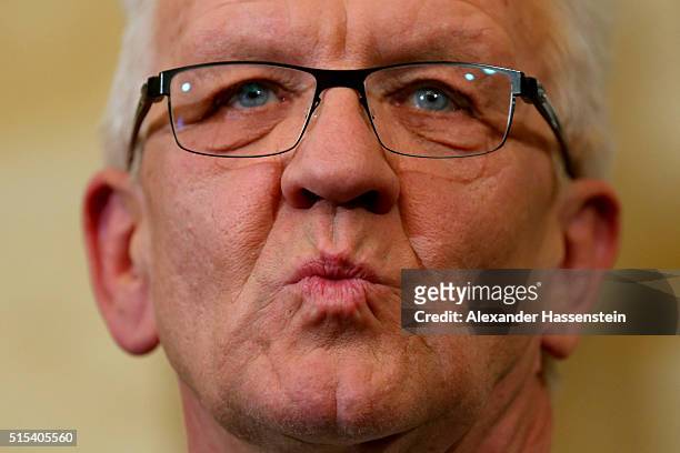 Winfried Kretschmann, incumbent governor of Baden-Wuerttemberg and member of the German Greens Party reacts during a press conference on election...