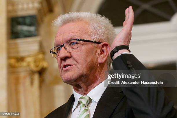 Winfried Kretschmann, incumbent governor of Baden-Wuerttemberg and member of the German Greens Party reacts during a press conference on election...