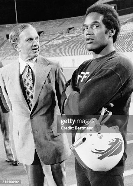 Buffalo Bills owner Ralph Wilson chats with O.J. Simpson after practice Sunday evening at Rick Stadium. Simpson hopes to play some in the Bills...
