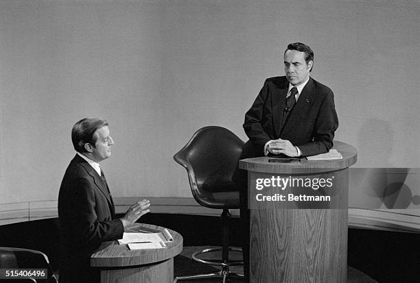 Houston: GOP vice presidential candidate Robert Dole listens as his opponent, Democrat Walter Mondale, makes a point during their nationally...