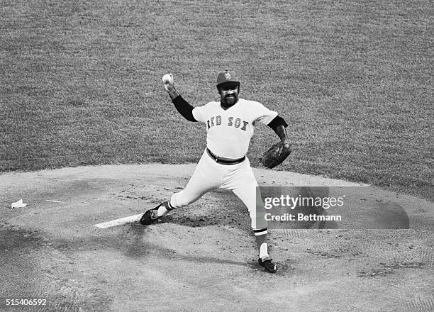 World Series-6th-game. Boston: Red Sox pitcher Luis Tiant on the mound for the 6th game is ready to let go with a pitch to Re's Joe Morgan. Tiant has...