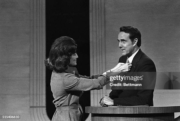 Vice-Presidential candidate Robert Dole has his tie straightened by his wife, Elizabeth, as he viewed Houston's Alley Theater 10/15. Dole will meet...