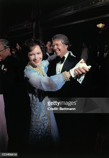 Washington: President and Mrs. Carter are all smiles as they step out on the dance floor at the Mayflower Hotel, the site of seven Inaugural Balls.