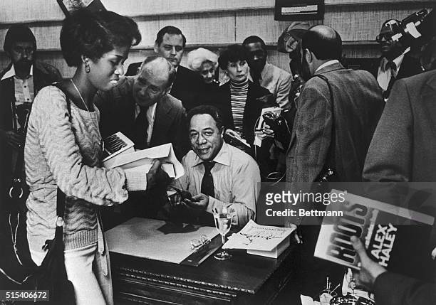 Crowd throngs around Alex Haley, author of book, Roots, at the Broadway department store book department in Fox Hills Mall. Those waiting to have...