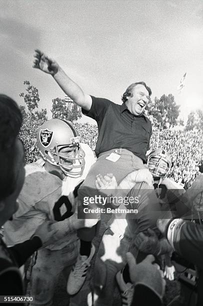 Head football coach John Madden is carried on the shoulders of the Oakland Raiders Football Team after winning their first Super Bowl. The Raiders...