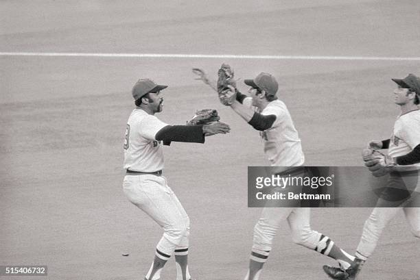 Cincinnati: Red Sox first baseman, who made the final out catching Joe Morgan's pop up with two men on, rushes to embrace pitcher Luis Tiant who beat...