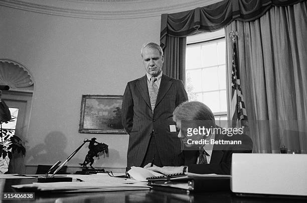 Washington, DC: With federal energy chief James Schlesinger looking on, President Carter, January 26, signed a request to Congress for new emergency...