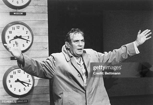 Actor Peter Finch, as television news anchor Howard Beale, exhorts his television followers to revolt and express themselves in this scene from the...